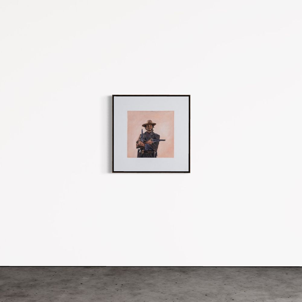 Framed artwork of a person in a cowboy hat on a white wall.