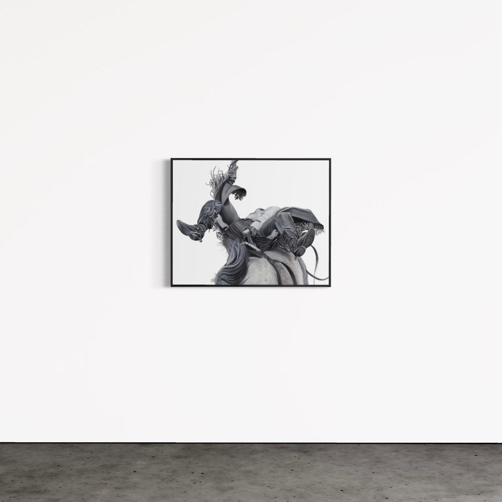 Framed black and white artwork of a dancer on a plain wall.