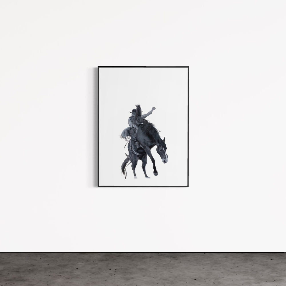 Framed artwork of a person riding a horse on a white wall.