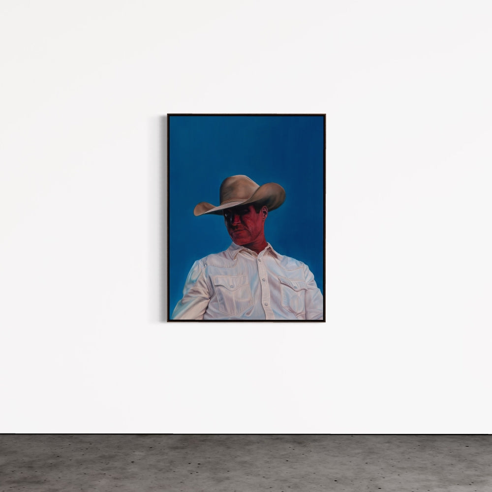 Framed artwork of a person wearing a cowboy hat against a blue background