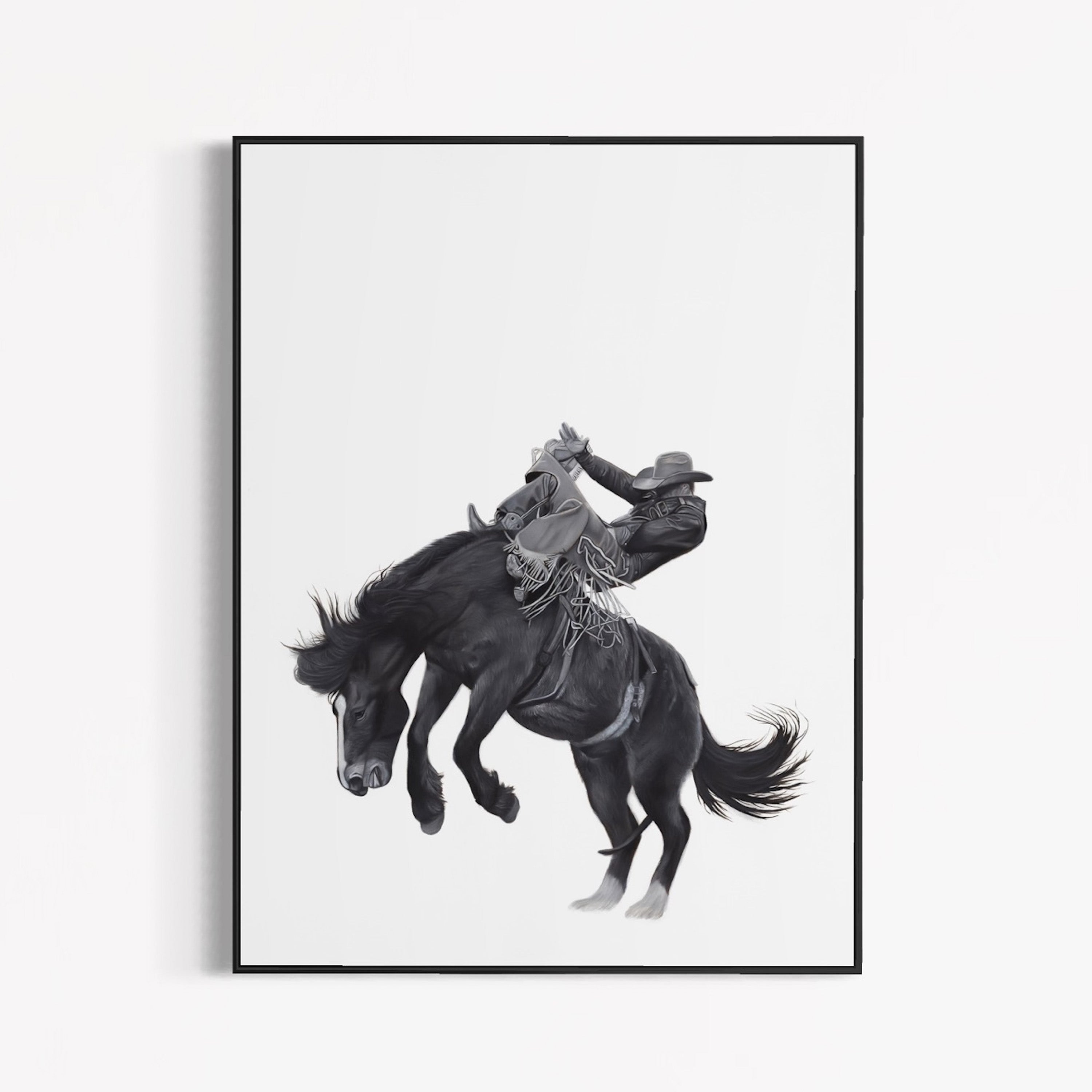 Framed artwork of a cowboy riding a bucking horse on a white background