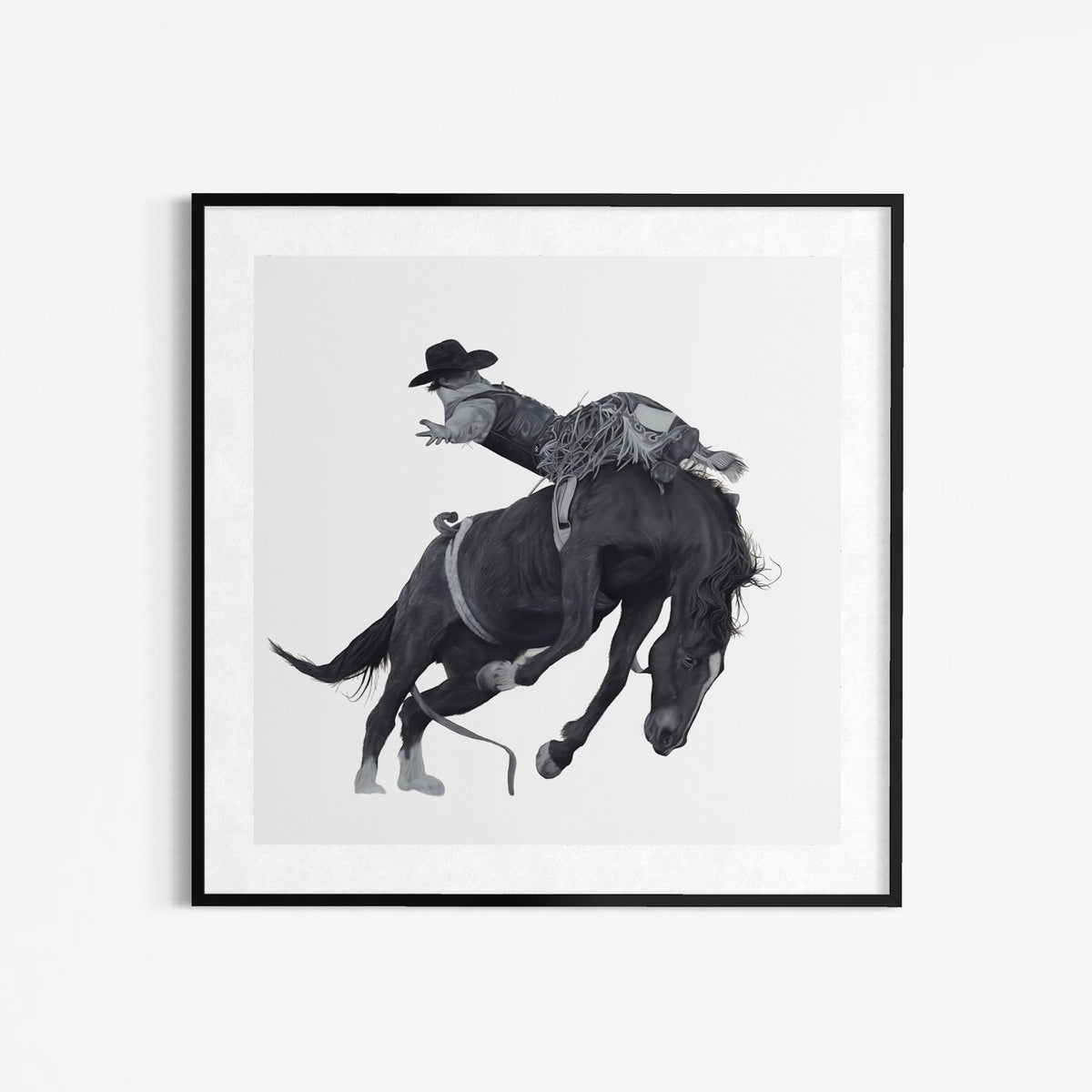 Framed artwork of a cowboy riding a bucking horse on a white background