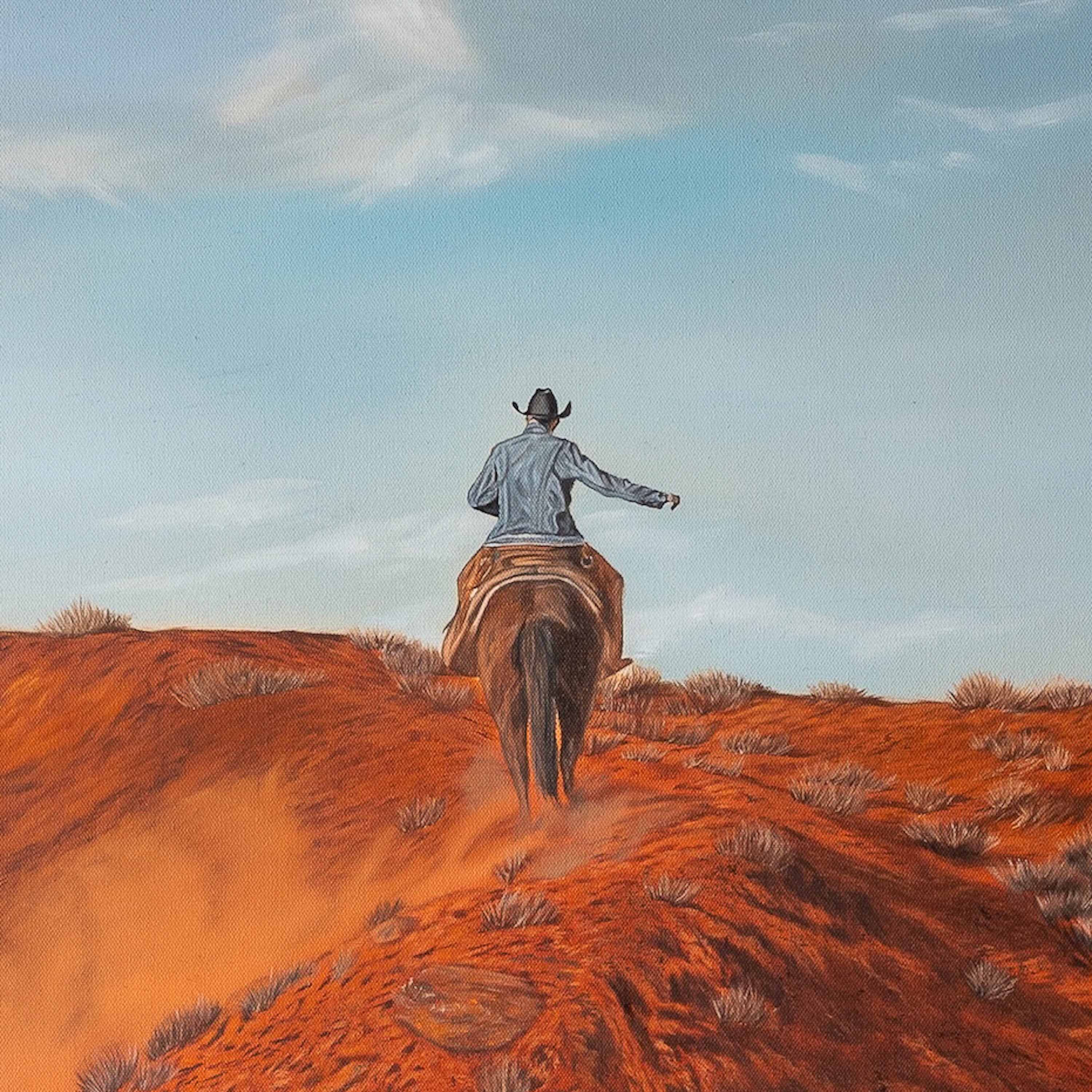 Cowboy riding a horse on a dirt path with a blue sky and clouds in the background