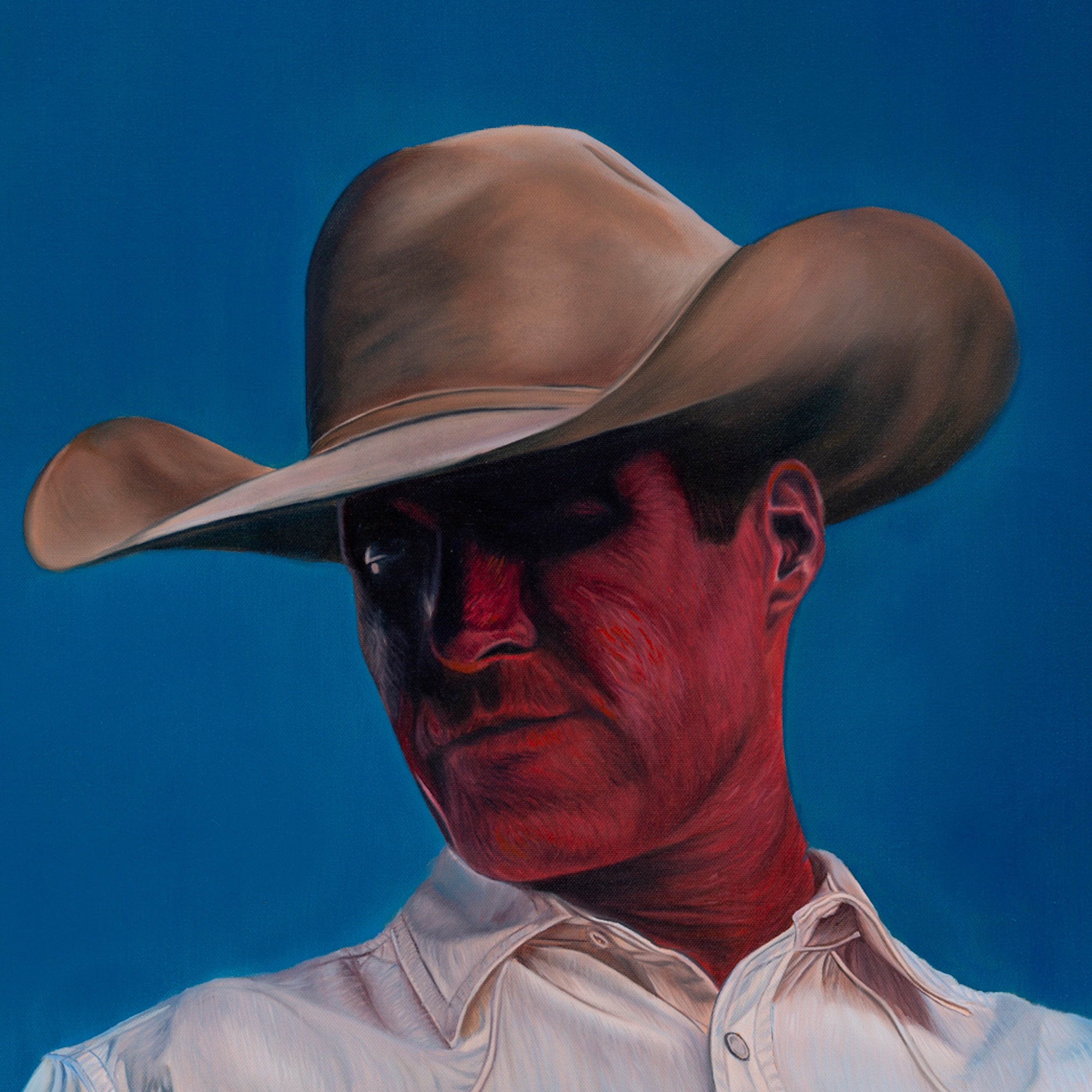 Man wearing a cowboy hat with a red face against a blue background