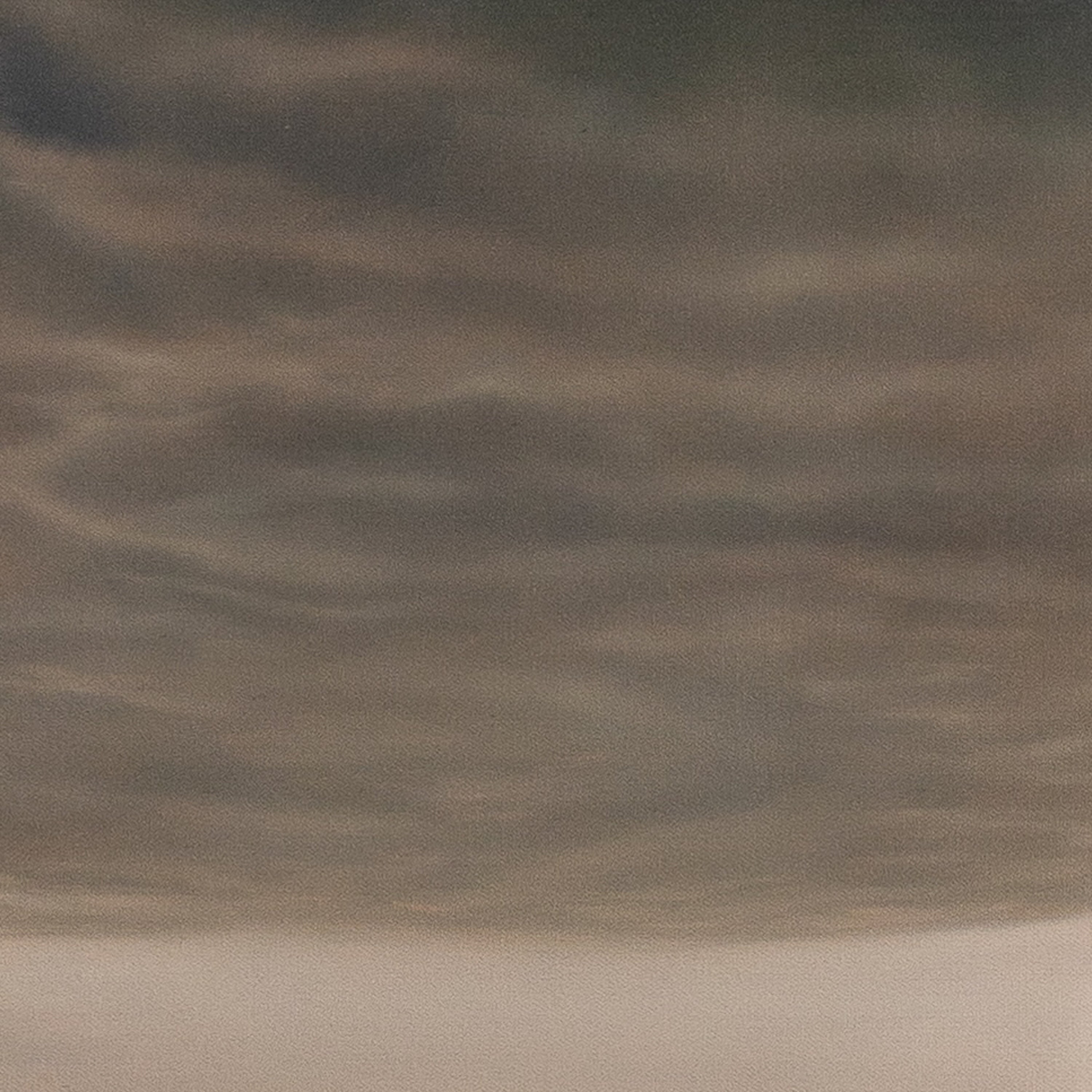 Dark gray clouds in a sky with a gradient effect