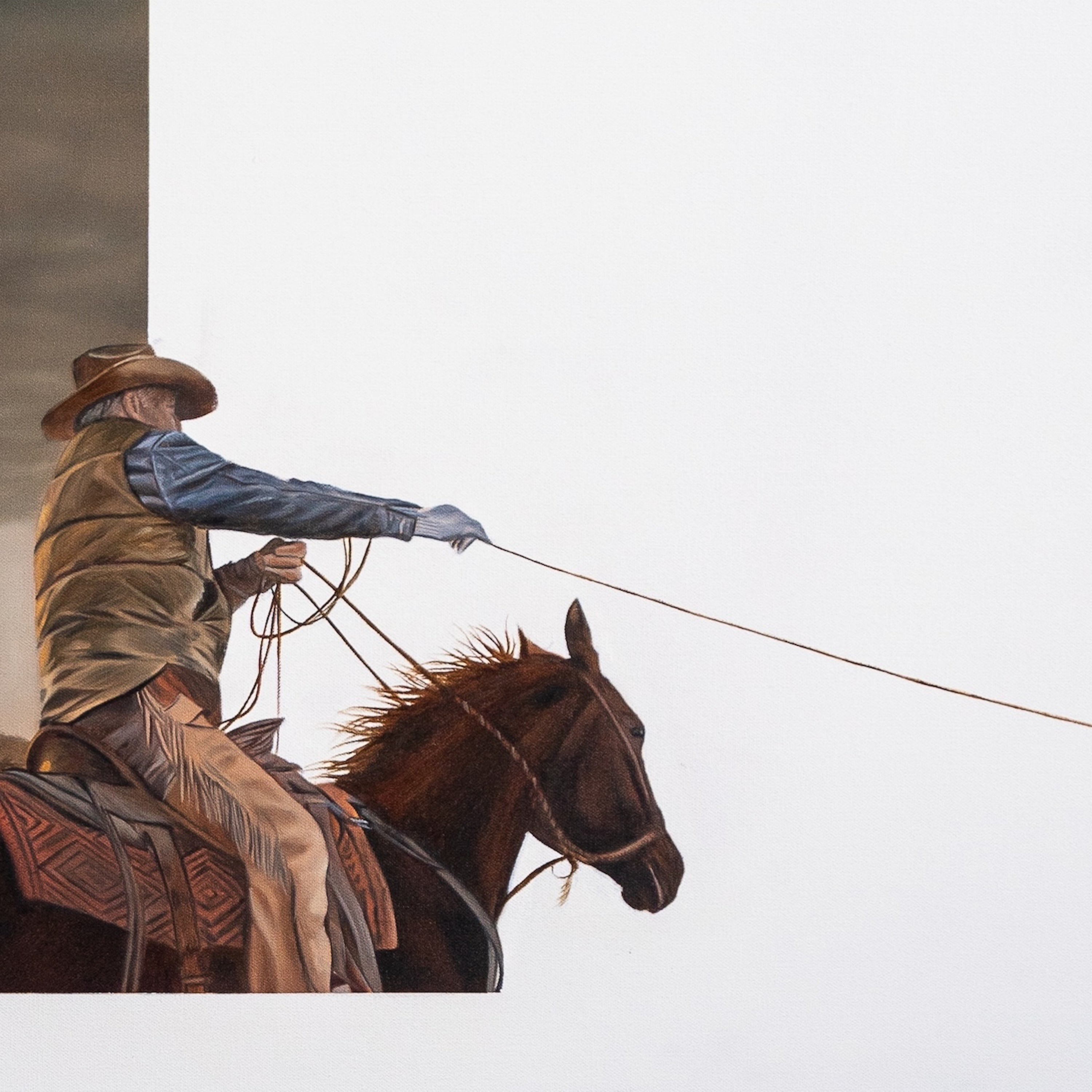 Cowboy on horseback with a white background