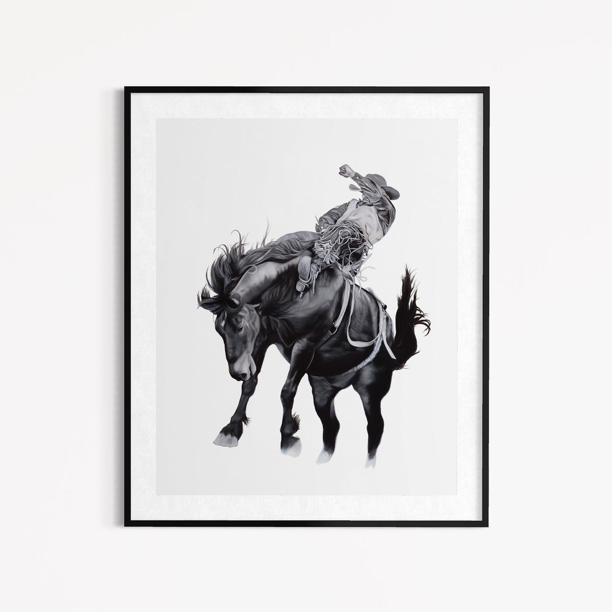 Framed artwork of a cowboy riding a horse on a white background