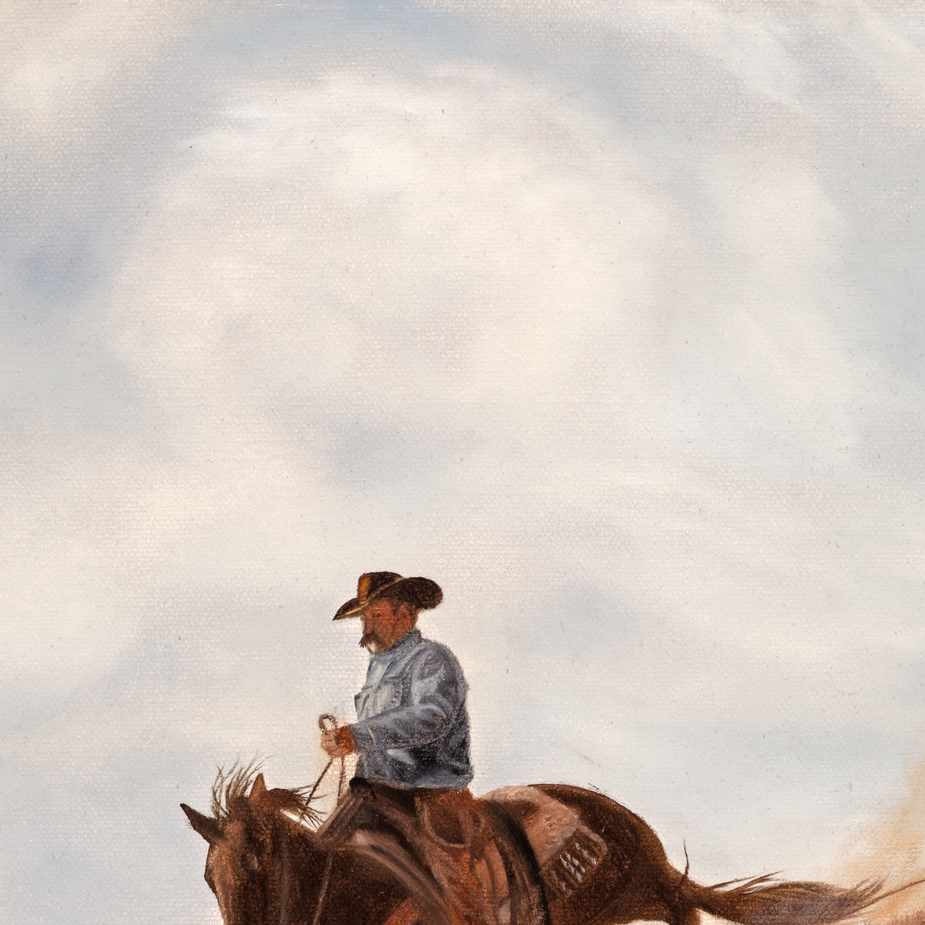 Man on horseback against a cloudy sky