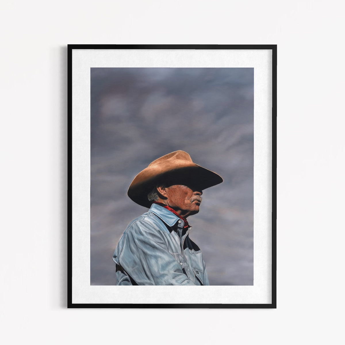 Framed artwork of a person wearing a cowboy hat against a cloudy sky.